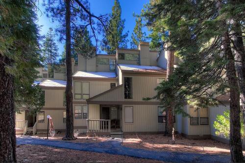 a large building with trees in front of it at Cheyenne's Place home in Kings Beach