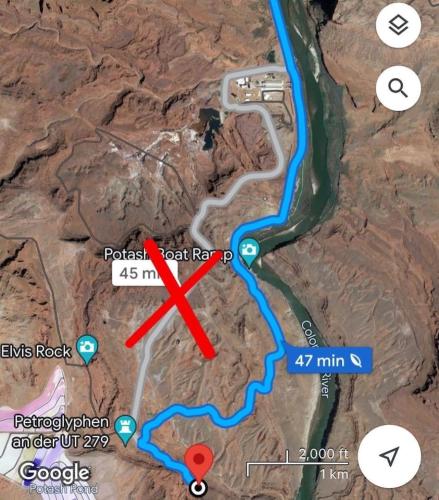 a map with a red arrow pointing to a road at Glamping Queen Tent At Private Riverside Ranch in Moab