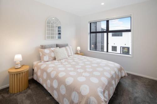 a bedroom with a bed and a window at Groveview Oasis 1BR Retreat in Lower Hutt
