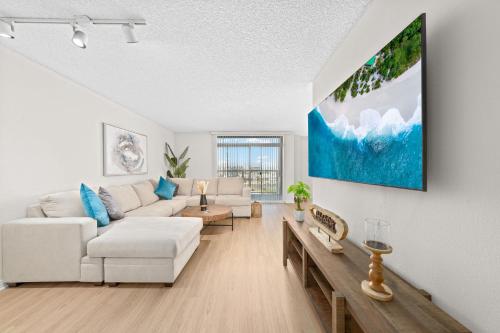 a living room with a couch and a table at The Lilas-Ocean view Stay high floor Pool Parking in Los Angeles