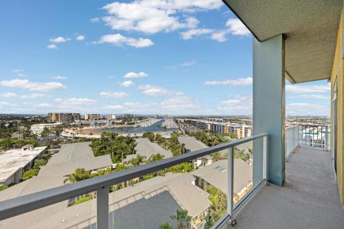 a balcony with a view of a river and buildings at The Lilas-Ocean view Stay high floor Pool Parking in Los Angeles