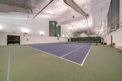 a gym with a tennis court in the middle at Secluded Retreat w Hot Tub, FirePit & Pool Access in Hedgesville