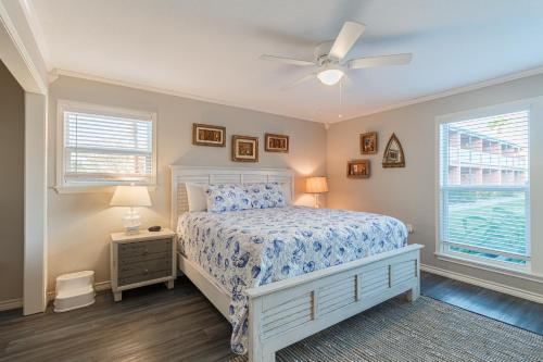a bedroom with a bed and a ceiling fan at Executive Keys Condominiums on the Beach in Port Aransas