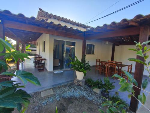 a view of a house with a patio at Casa com Piscina em Búzios in Buzios