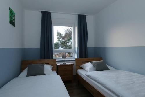 Postel nebo postele na pokoji v ubytování Ferienhaus Waldecker Auszeit