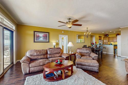 a living room with furniture and a ceiling fan at Reserve 36-D in Sugar Mountain