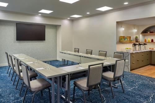a conference room with a large table and chairs at Renaissance Charlotte SouthPark Hotel in Charlotte
