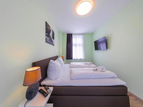 Una cama o camas en una habitación de Ferienwohnung Remise, Wernigerode