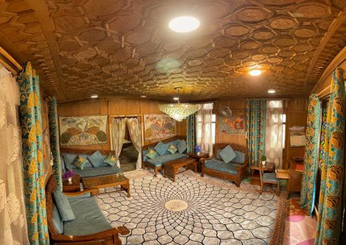a living room with couches and chairs in a train at HB Freedom group of Houseboats in Srinagar