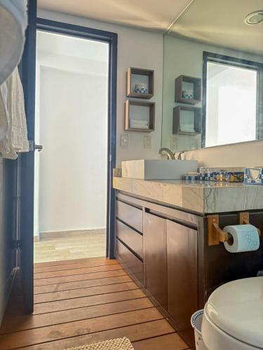 a bathroom with a sink and a toilet at TERRA 1B CONDO - Nuevo Nayarit in Nuevo Vallarta