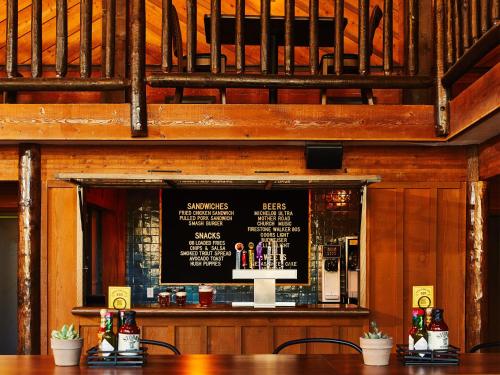 a bar with a chalkboard on the wall at Trailborn Grand Canyon, Outdoor Collection by Marriott Bonvoy in Williams