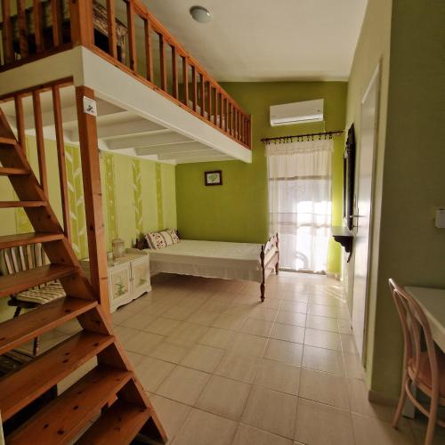 a room with a bunk bed and a staircase at Asklipion Valley guest house in Kos Town