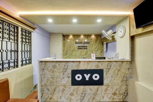 a ovo sign on the front of a store at Hotel O Azhar lodge in Calicut