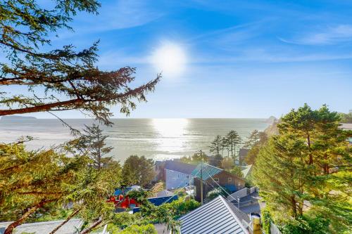 an aerial view of a house and the ocean at La Petite Maison in Oceanside
