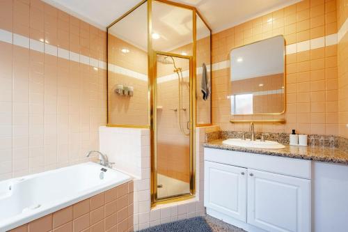 a bathroom with a sink and a shower at Pool Spa Games Peaceful Garden Retreat in Glendale