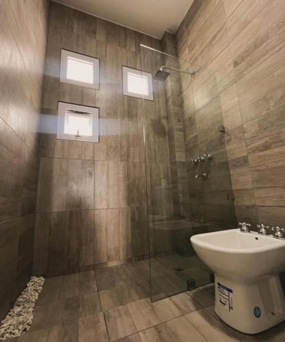 a bathroom with a toilet and a sink and a shower at Inti Belén in Belén