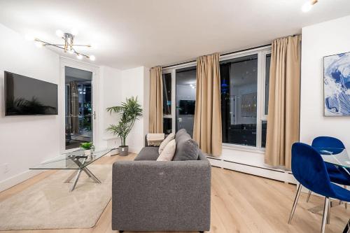a living room with a couch and a table at Gorgeous Downtown Unit with City Views in Vancouver