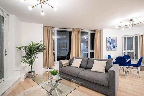a living room with a couch and a table at Gorgeous Downtown Unit with City Views in Vancouver