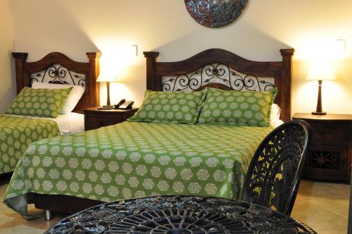 Säng eller sängar i ett rum på Hoteles Bogotá Inn La Soledad