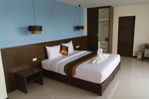 a bedroom with two beds in a room at VISA Hotel Hua Hin - SHA Plus in Hua Hin