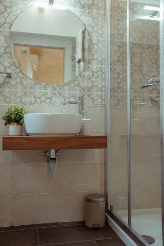 a bathroom with a sink and a mirror at Casa Vacanza Il Piccolo Principe in Ginosa