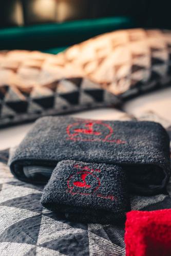 two towels sitting on top of a bed at Penzion Hádlík in Velké Pavlovice