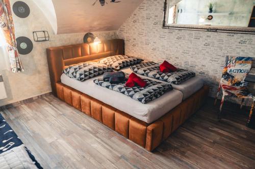 two beds with pillows on them in a room at Penzion Hádlík in Velké Pavlovice