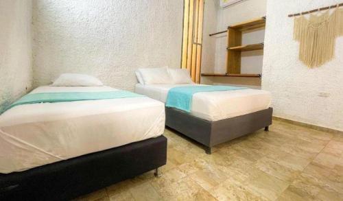 Hotel Palmas del Ríoにあるベッド