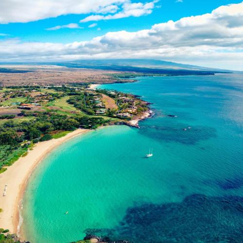 an aerial view of a beach and the ocean at Hale Polū in Waikoloa Village
