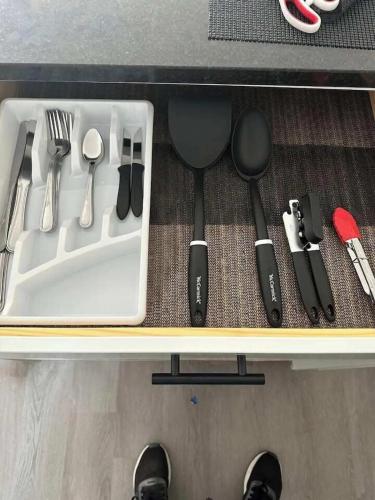 a drawer filled with utensils and utensils at Harborside Suites in Yarmouth