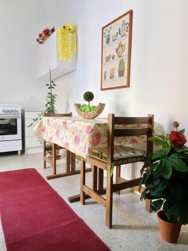 a dining room with a table and two chairs at Rio Mare in Termoli
