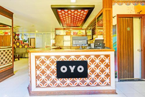 a restaurant with an oo sign on a counter at Hotel O Sahasra Residency Near Nexus Hyderabad in Hyderabad
