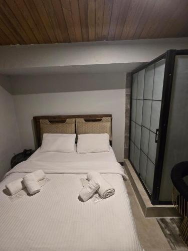 Ένα ή περισσότερα κρεβάτια σε δωμάτιο στο KLC Apart Otel