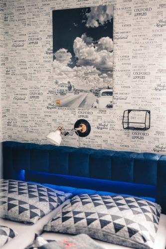 a bedroom with a wall with writing on it at Penzion Hádlík in Velké Pavlovice