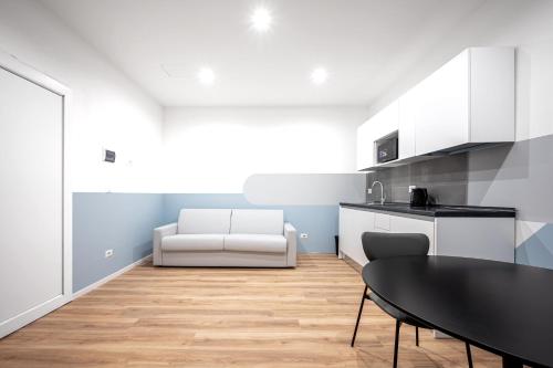 a kitchen with a table and a dining room at - NumberZ - Rooms Apartments and Suites with Wi-Fi and AC in Borgo Isonzo