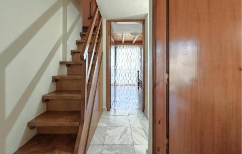 a hallway with stairs in a home with a door at Amazing Home In Diakopto Achaias P in Diakopto
