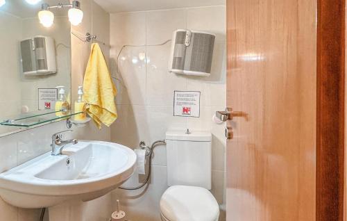 a bathroom with a toilet and a sink at Amazing Home In Diakopto Achaias P in Diakopto