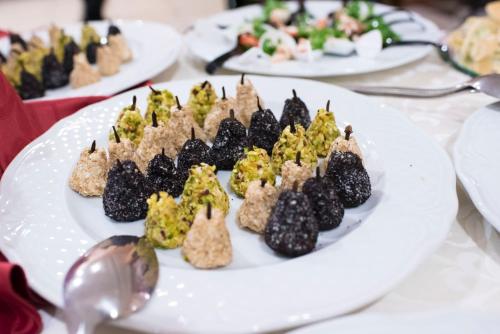 a white plate of food on a table at Grand Hotel Stella Maris Italia in Palmi