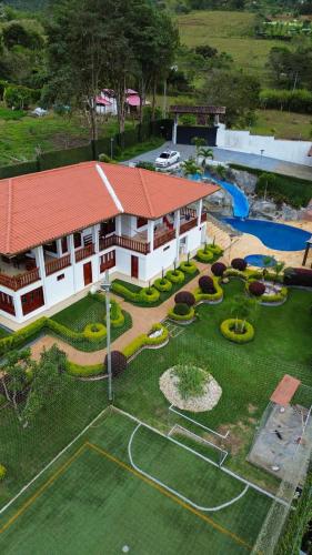 an aerial view of a house with a garden at VILLA ORION piscina y discoteca PRIVADA K18 in Cali