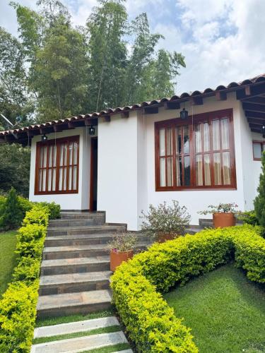 a house with a staircase leading up to it at VILLA ORION piscina y discoteca PRIVADA K18 in Cali