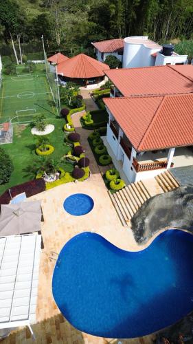 an aerial view of a house with a swimming pool at VILLA ORION piscina y discoteca PRIVADA K18 in Cali