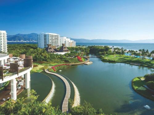 a view of a river with buildings and the ocean at 2BD Grand Luxxe Villa Nuevo in Nuevo Vallarta 