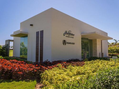 a building with a sign on the side of it at 2BD Grand Luxxe Villa Nuevo in Nuevo Vallarta 