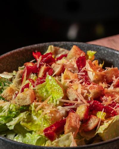 a bowl of salad with meat and lettuce at Hotel Casa Vertiz in Oaxaca City