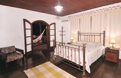 Ένα ή περισσότερα κρεβάτια σε δωμάτιο στο Pousada Tarituba