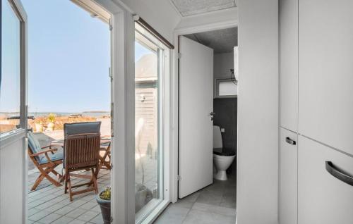 a room with a view of a kitchen and a balcony at 2 Bedroom Lovely Home In Assens in Assens