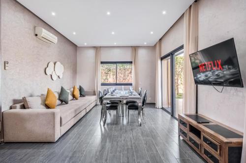 a living room with a couch and a table at Villa Lina 4 Chambres a Marrakech in Marrakech