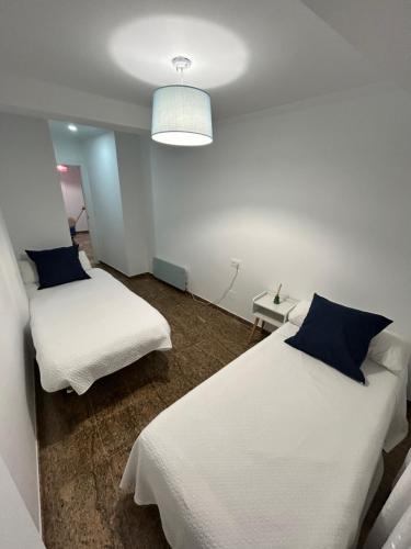Postel nebo postele na pokoji v ubytování Escapada Perfecta en Sanxenxo - Apartamento en Portonovo con Encanto