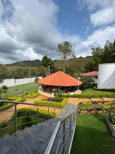 a view of a building with an orange roof at VILLA ORION piscina y discoteca PRIVADA K18 in Cali
