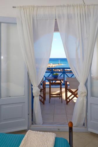 a room with a view of the ocean at Rodothea and Adams on the Beach, Santorini in Monolithos